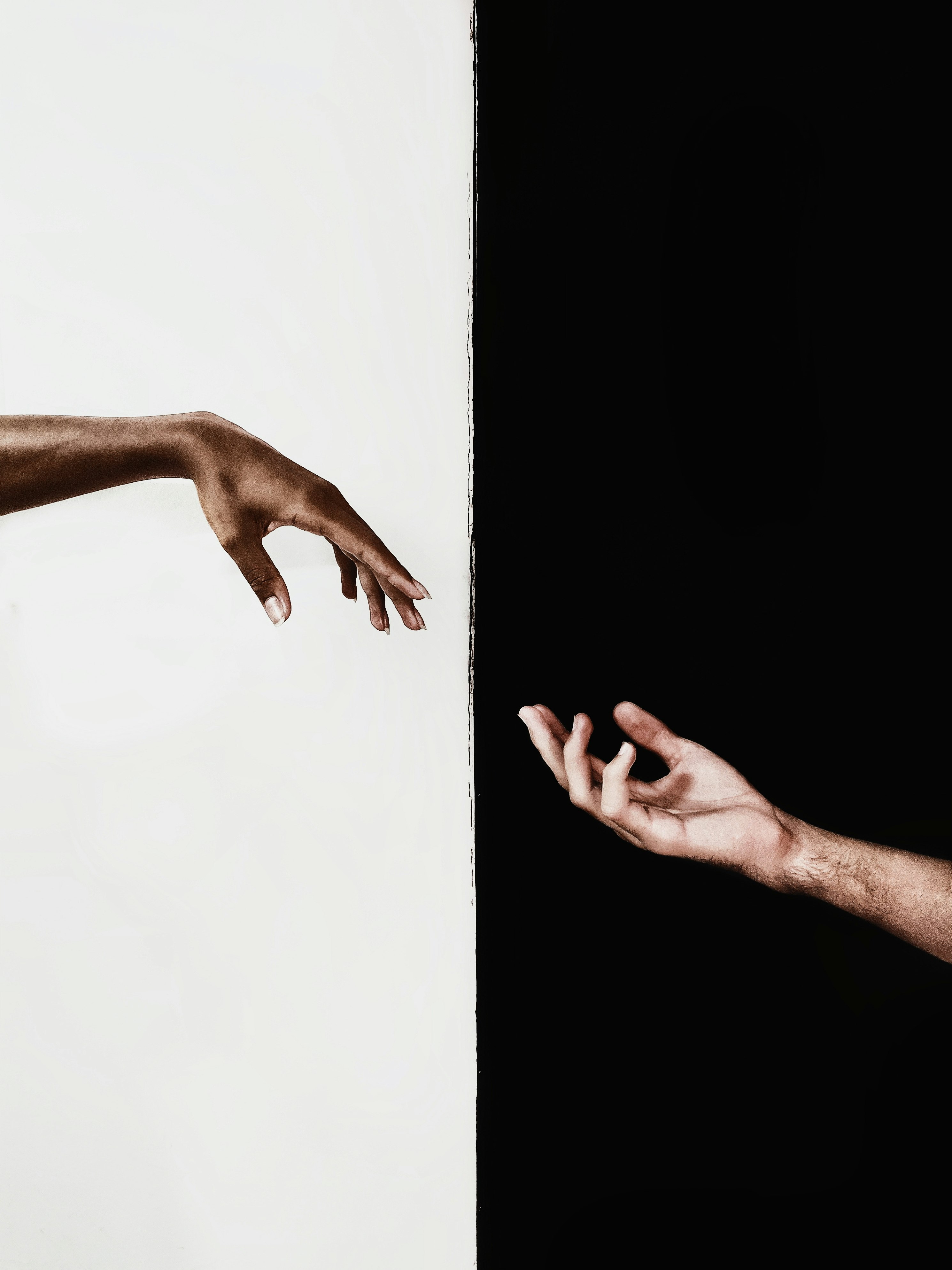 persons hand on white surface